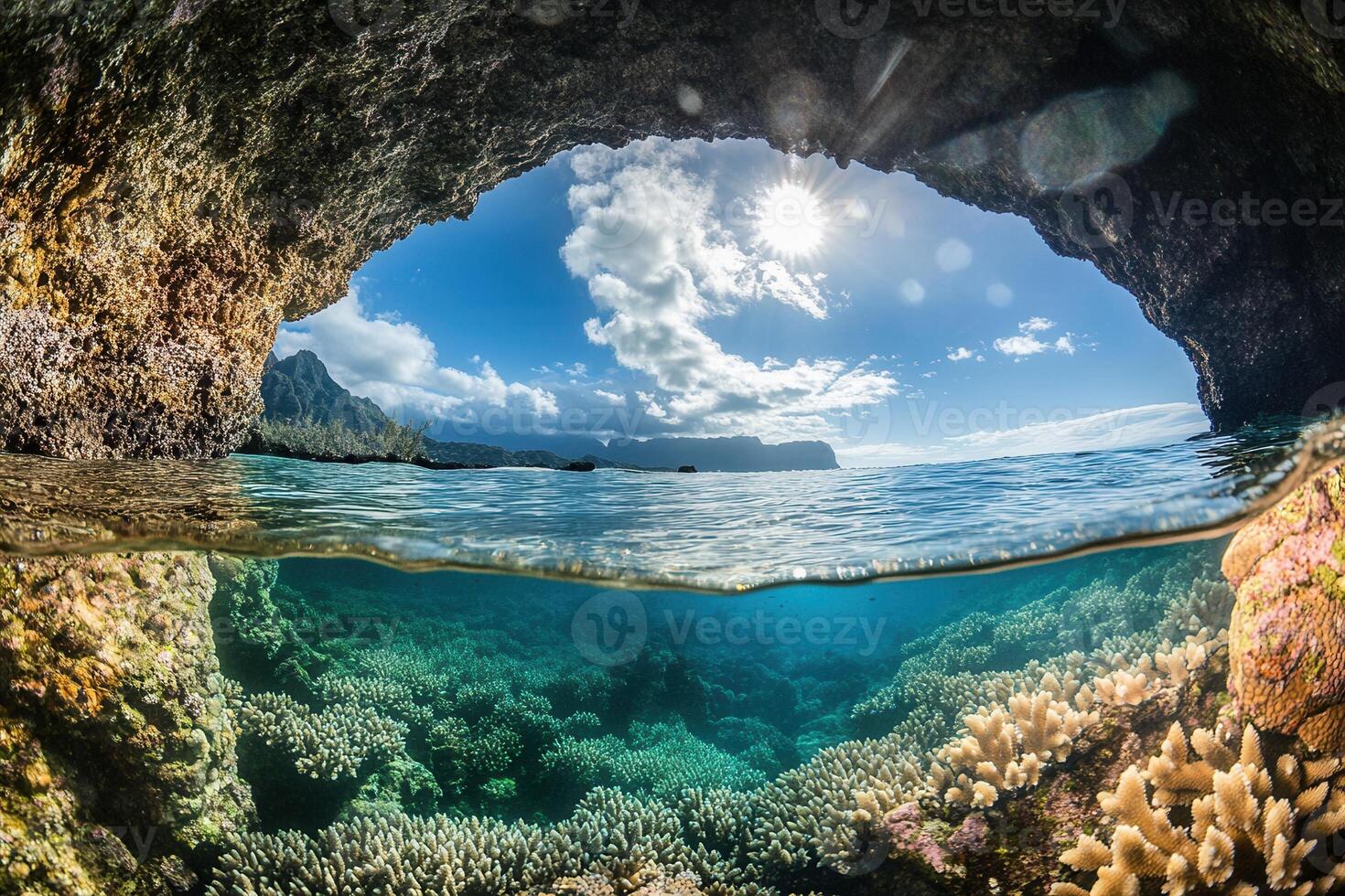 Underwater view of coral reef through a rocky arch. photo