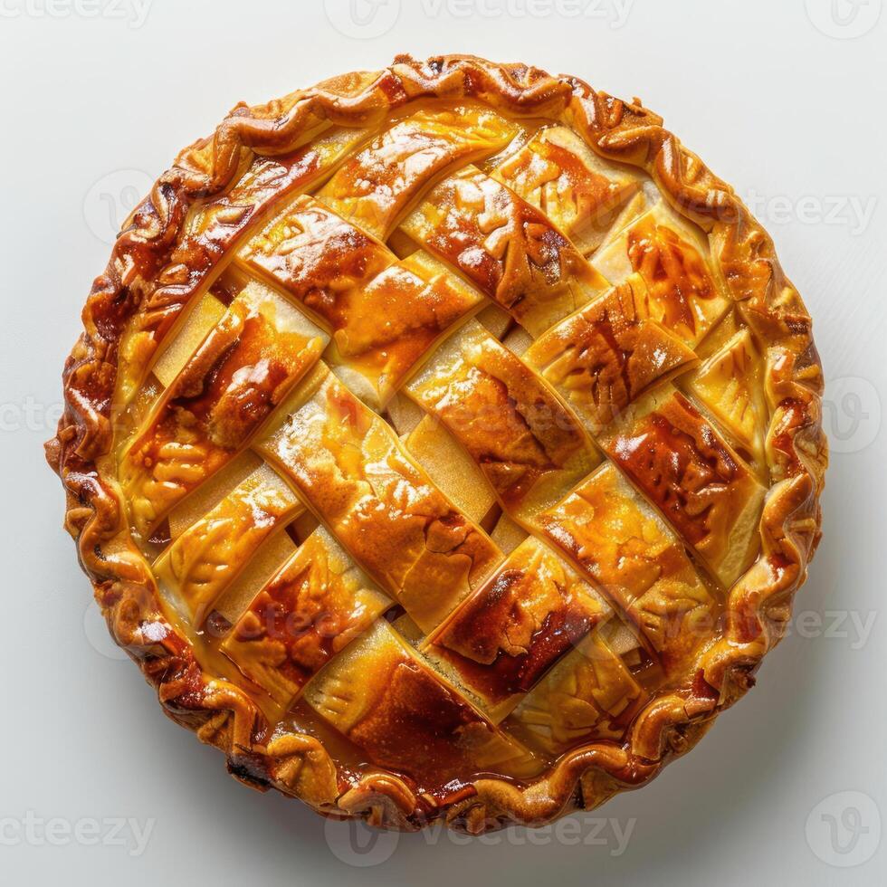A golden brown pastry pie with a lattice top and a glaze on top. The crust is flaky, photo