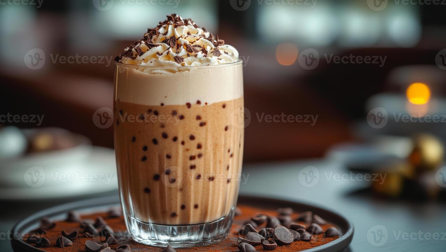 A glass of chocolate milk with whipped cream on top. The whipped cream is in the shape of a heart photo