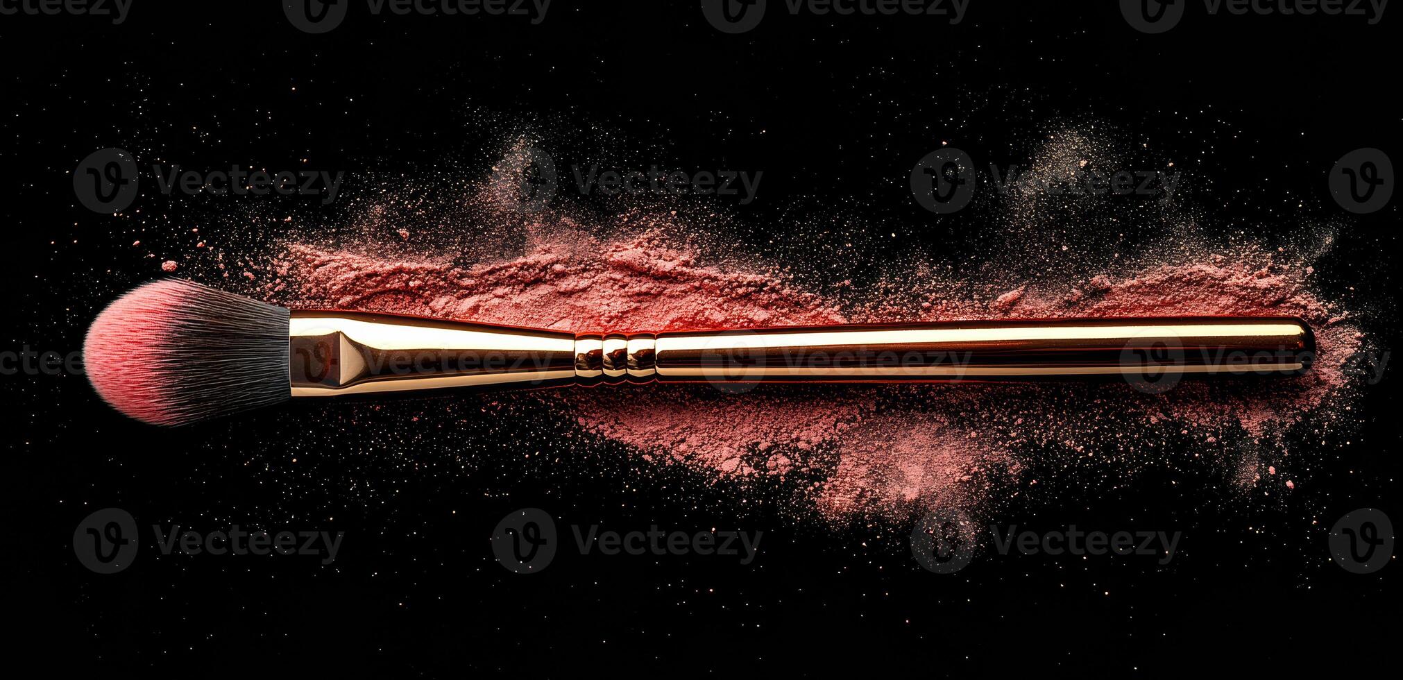 Blush brush on a dark background. A makeup brush rests on a dark surface, surrounded by scattered blush powder, highlighting beauty tools and application. photo
