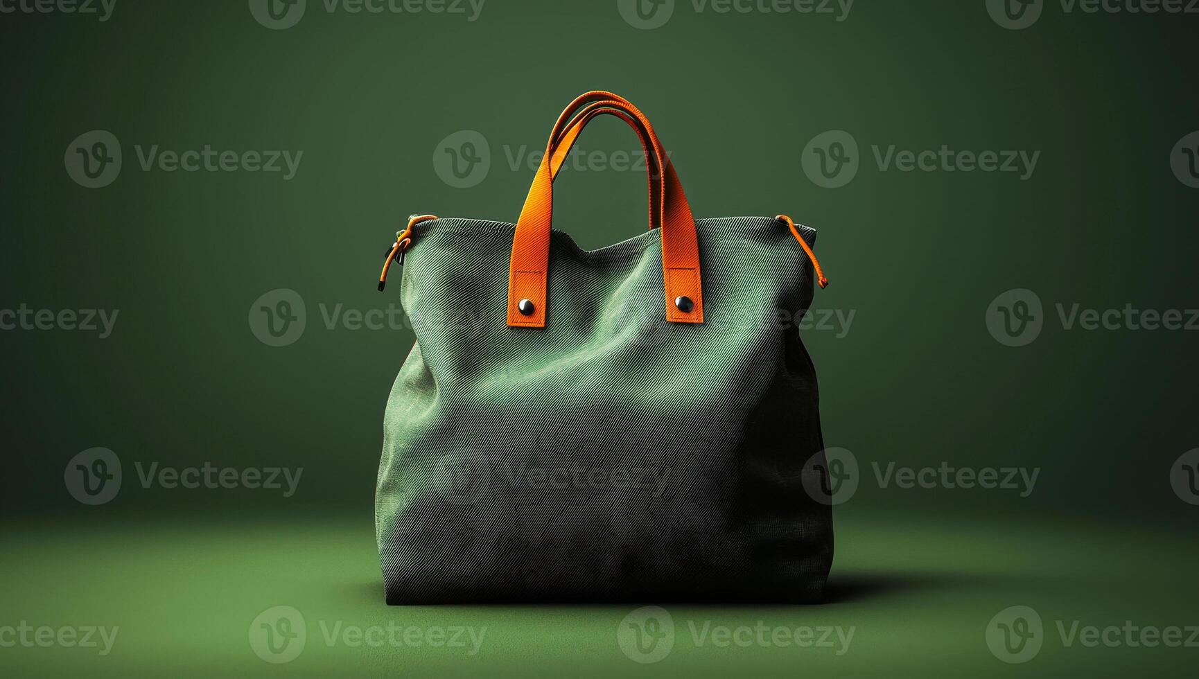A green and orange purse is displayed on a green background. The purse is made of leather and has a gold zipper. The purse is sitting on a table, and it looks like it's ready to be used photo