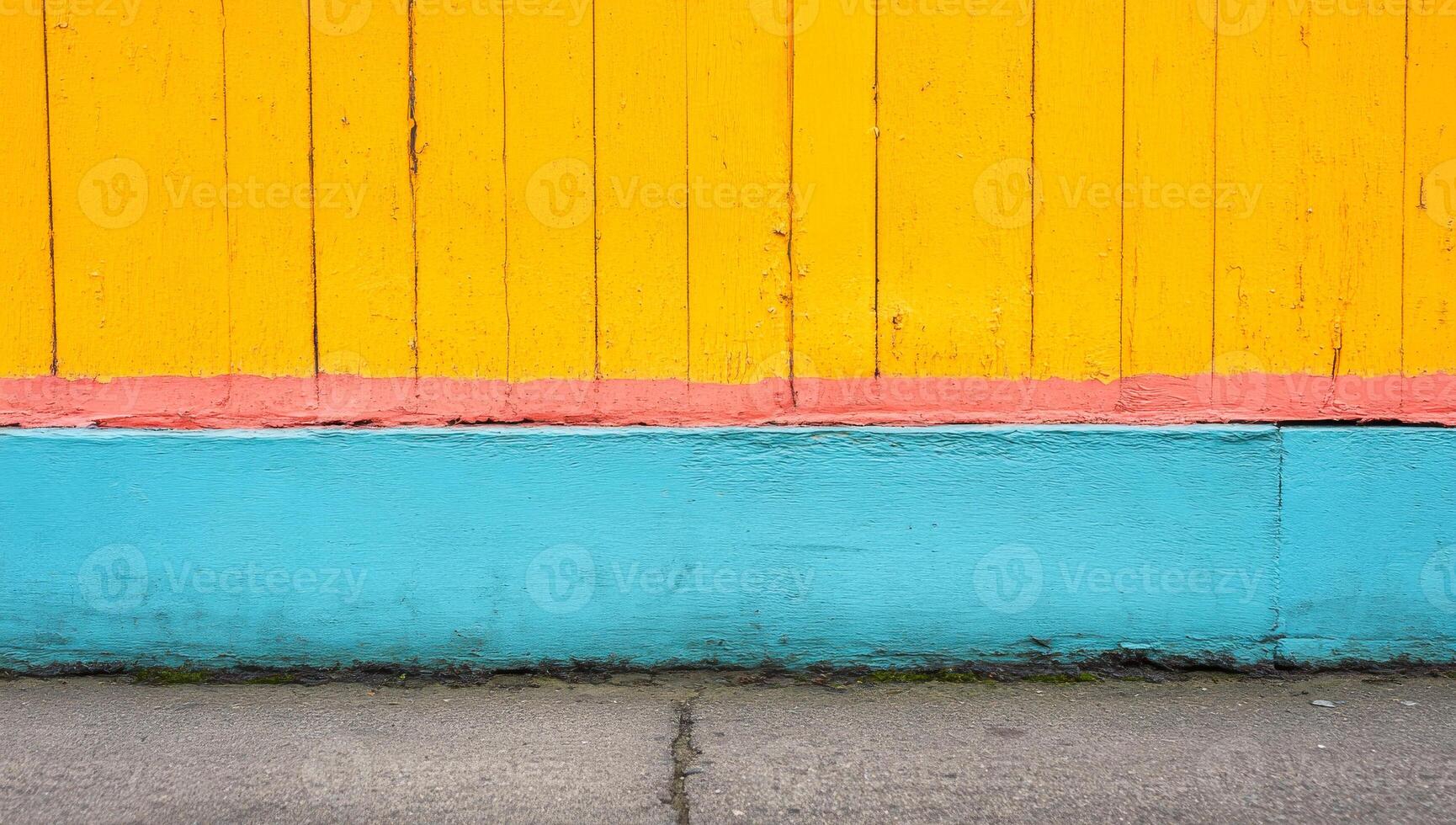 A yellow and blue wall with a red stripe. The wall is painted in a way that it looks like a fence photo