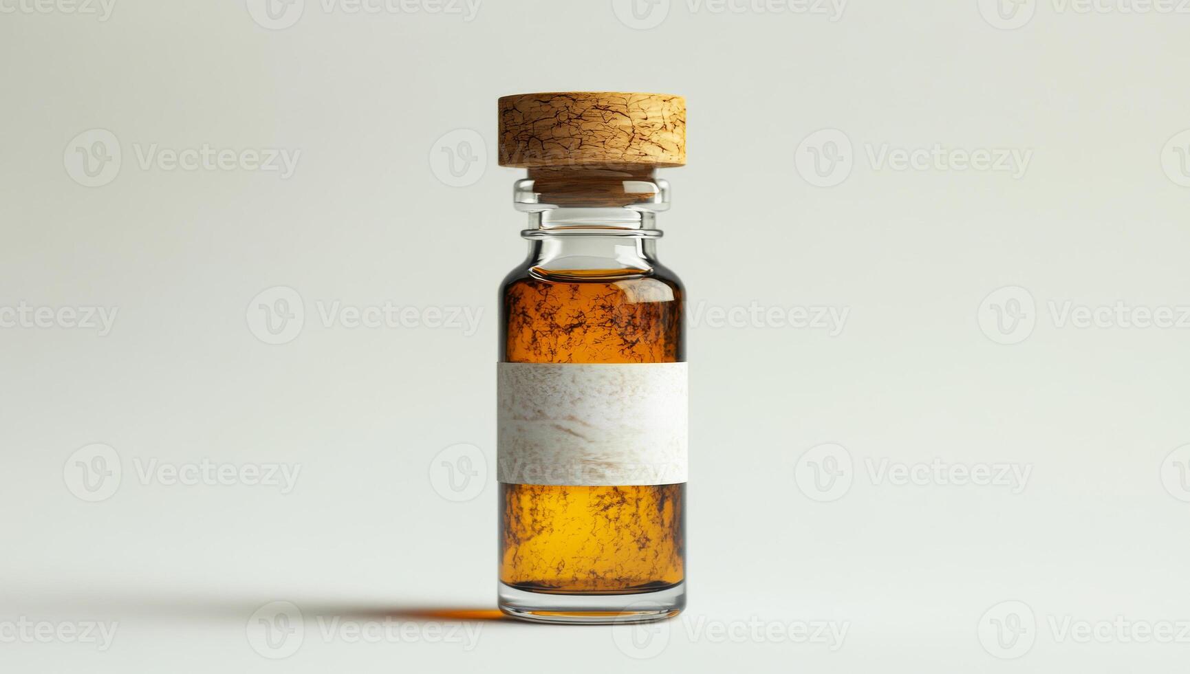 Amber liquid in elegant glass vial. A small glass vial with a cork stopper holds a rich amber liquid, highlighted against a soft background. photo