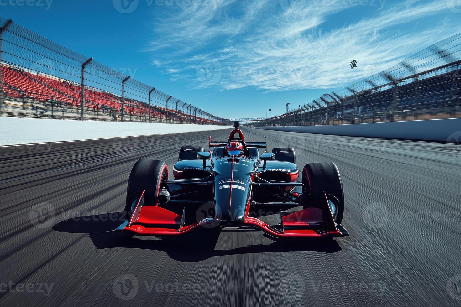 Racecar driver speeding on a racetrack during a race competition photo