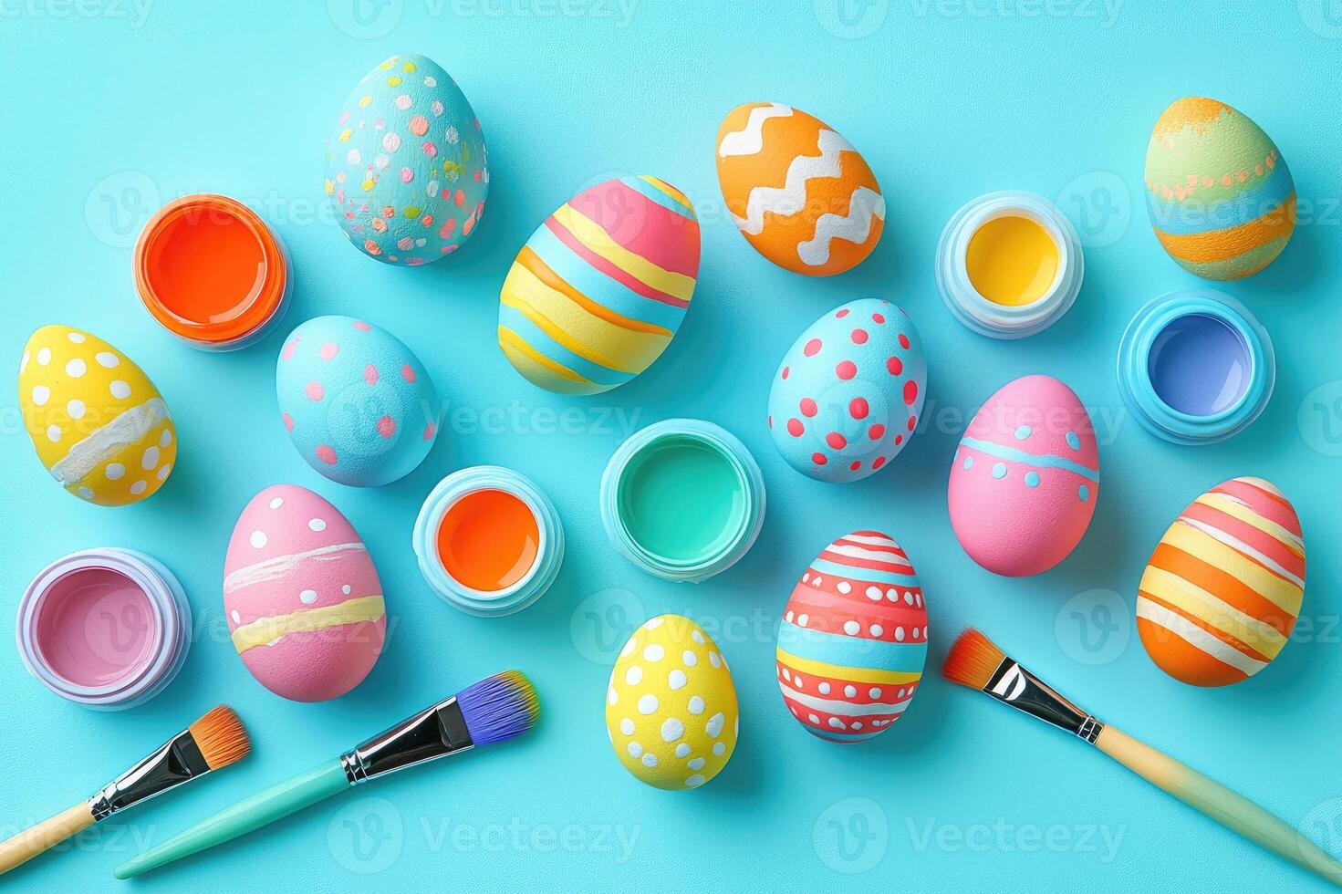 Colorful easter eggs painting with paint and brushes on turquoise background photo