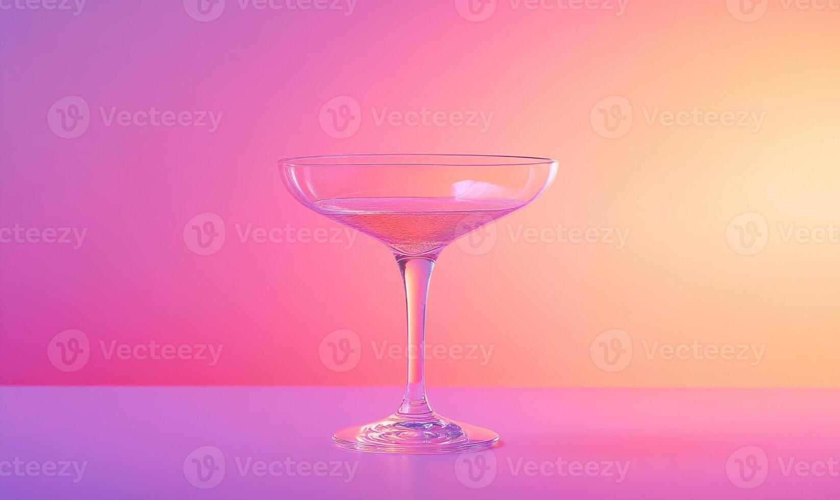 A glass of champagne is sitting on a table photo