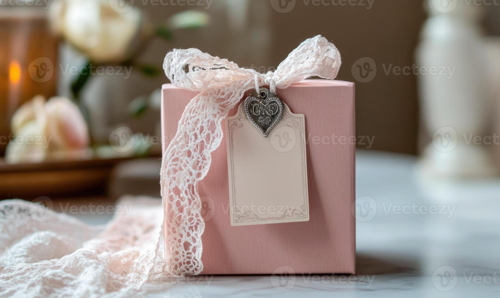 A pink box with a heart tag and a pink ribbon photo