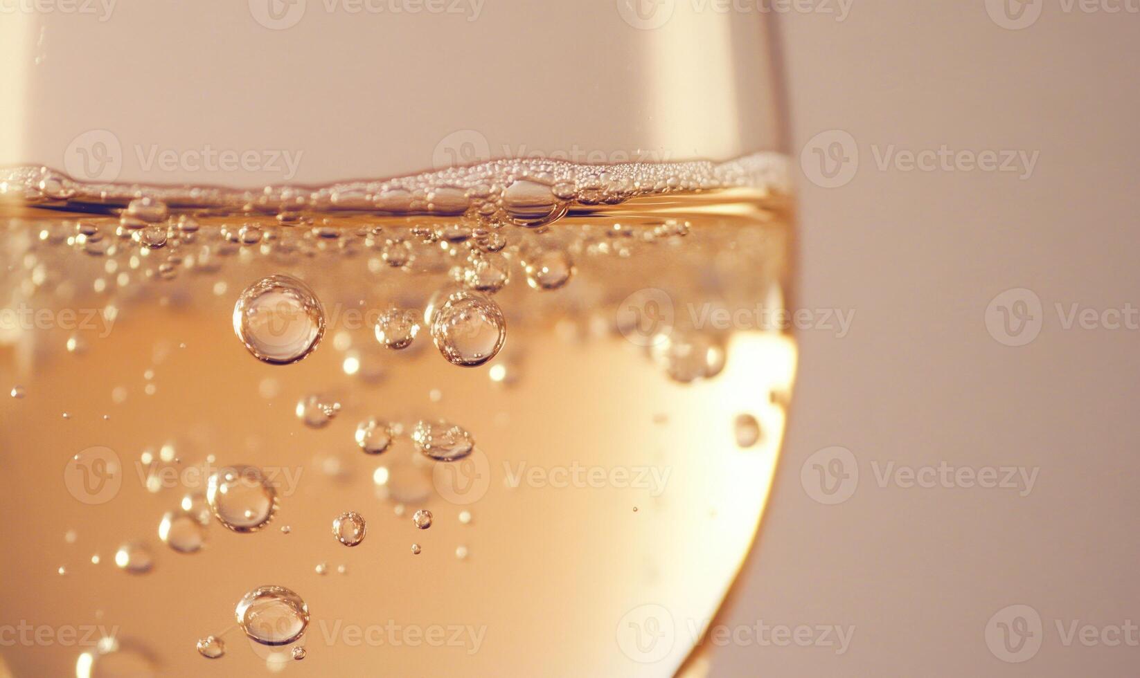 A glass of wine with bubbles in it photo