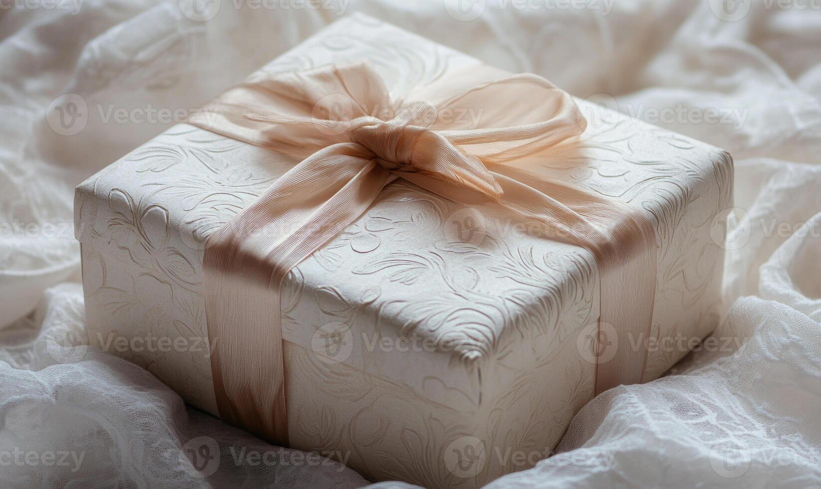 A white box with a bow on top photo
