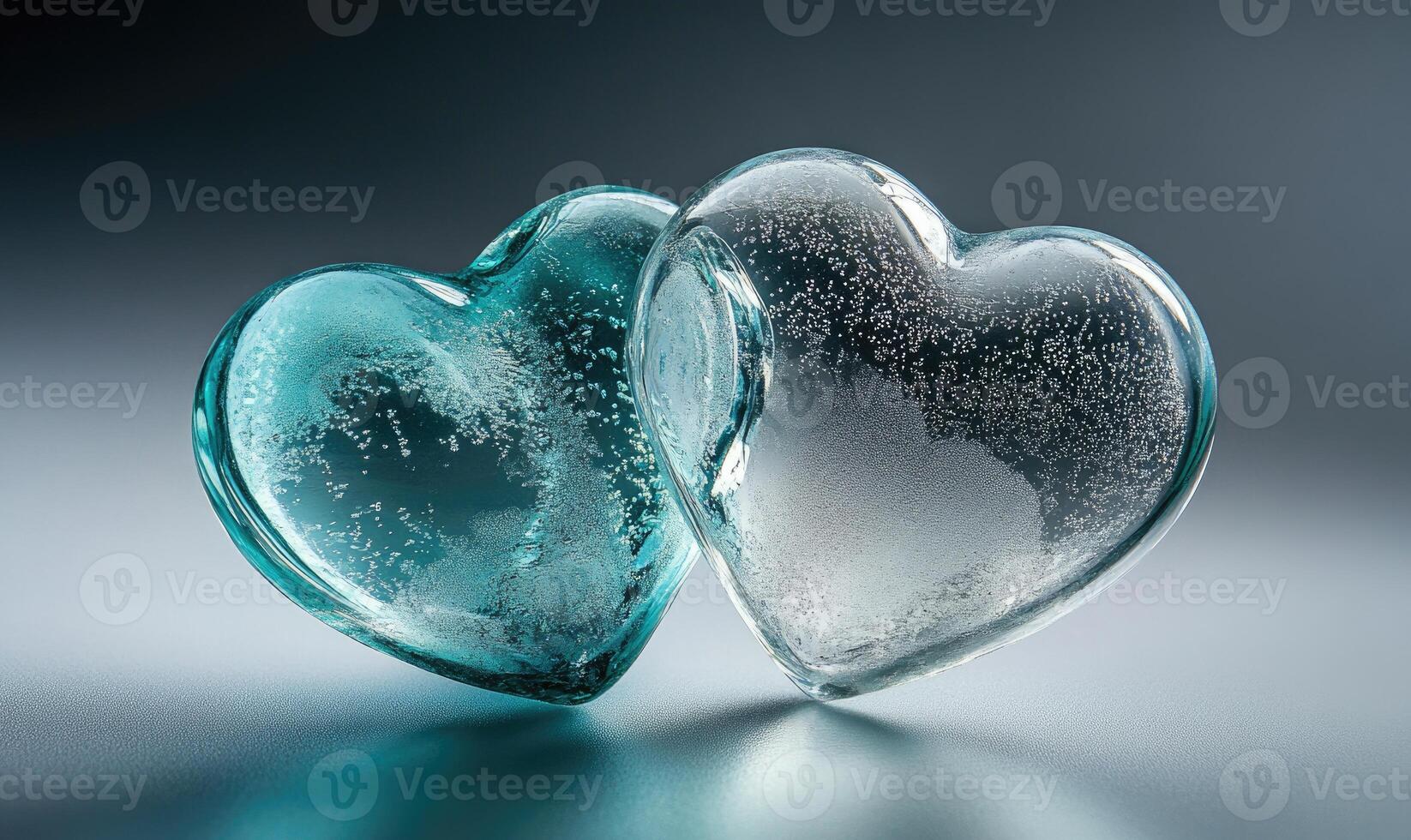Two hearts made of glass with a blue and white color photo