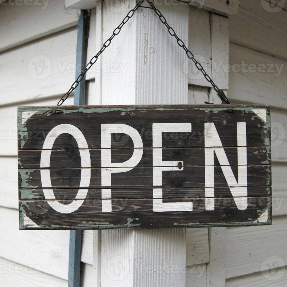 Weathered wooden signboard with OPEN written in white letters on white wall For Social Media Post Size photo