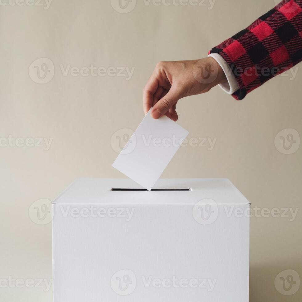 Ballot box with hand holding card, red checkered sleeve in focus For Social Media Post Size photo