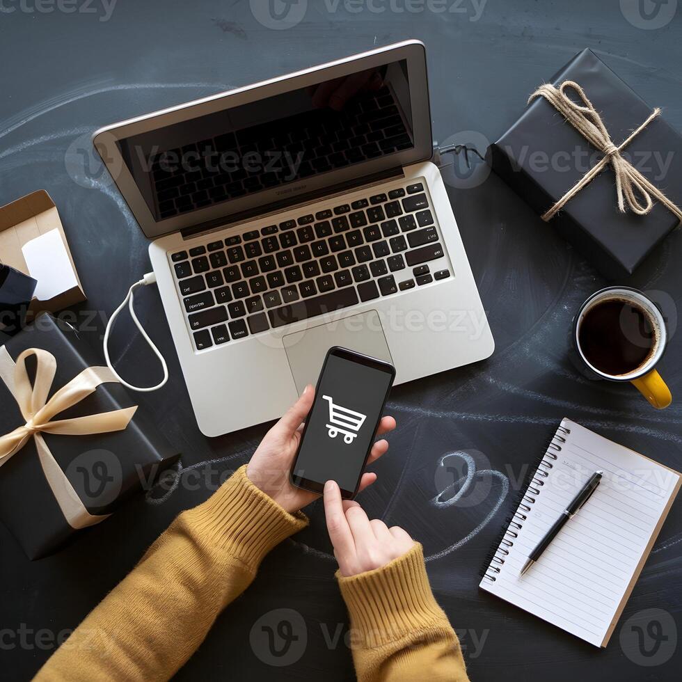 Workspace with laptop, smartphone showing shopping cart icon, suggesting online shopping For Social Media Post Size photo
