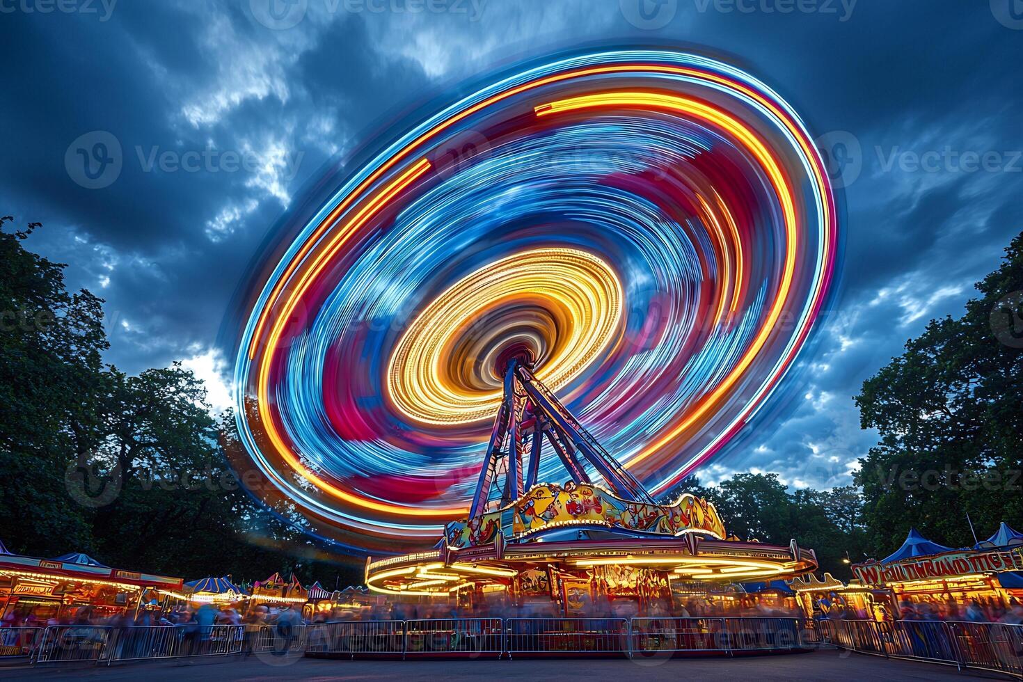 Colorful Spinning Ferris Wheel at Amusement Park on Cloudy Night photo
