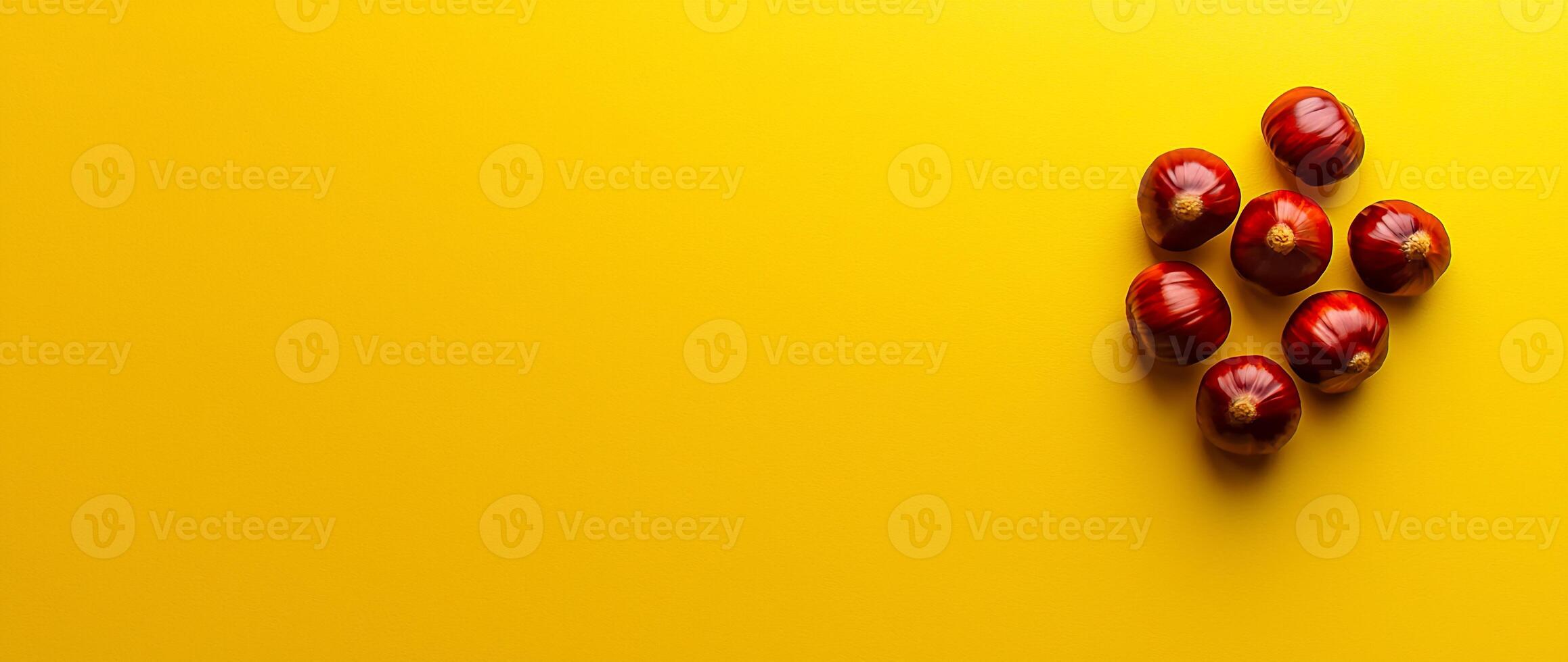 A Cluster of Fresh and Ripe Red Apples on a Vibrant Yellow Background photo