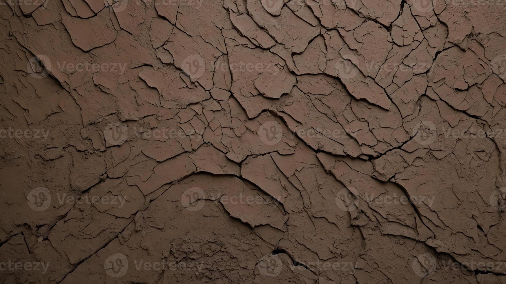A close up of a brown wall with cracks photo