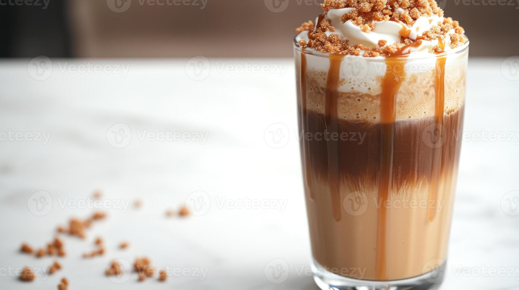 A layered coffee dessert topped with whipped cream, caramel, and crushed cookies photo