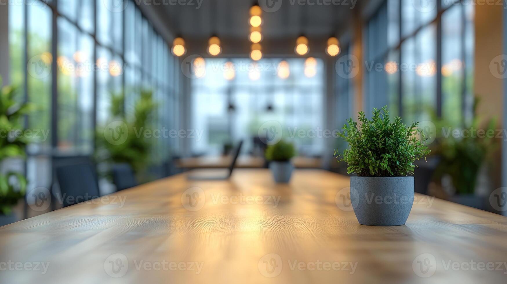 A sleek workspace features a long wooden table adorned with small potted plants and warm lighting photo