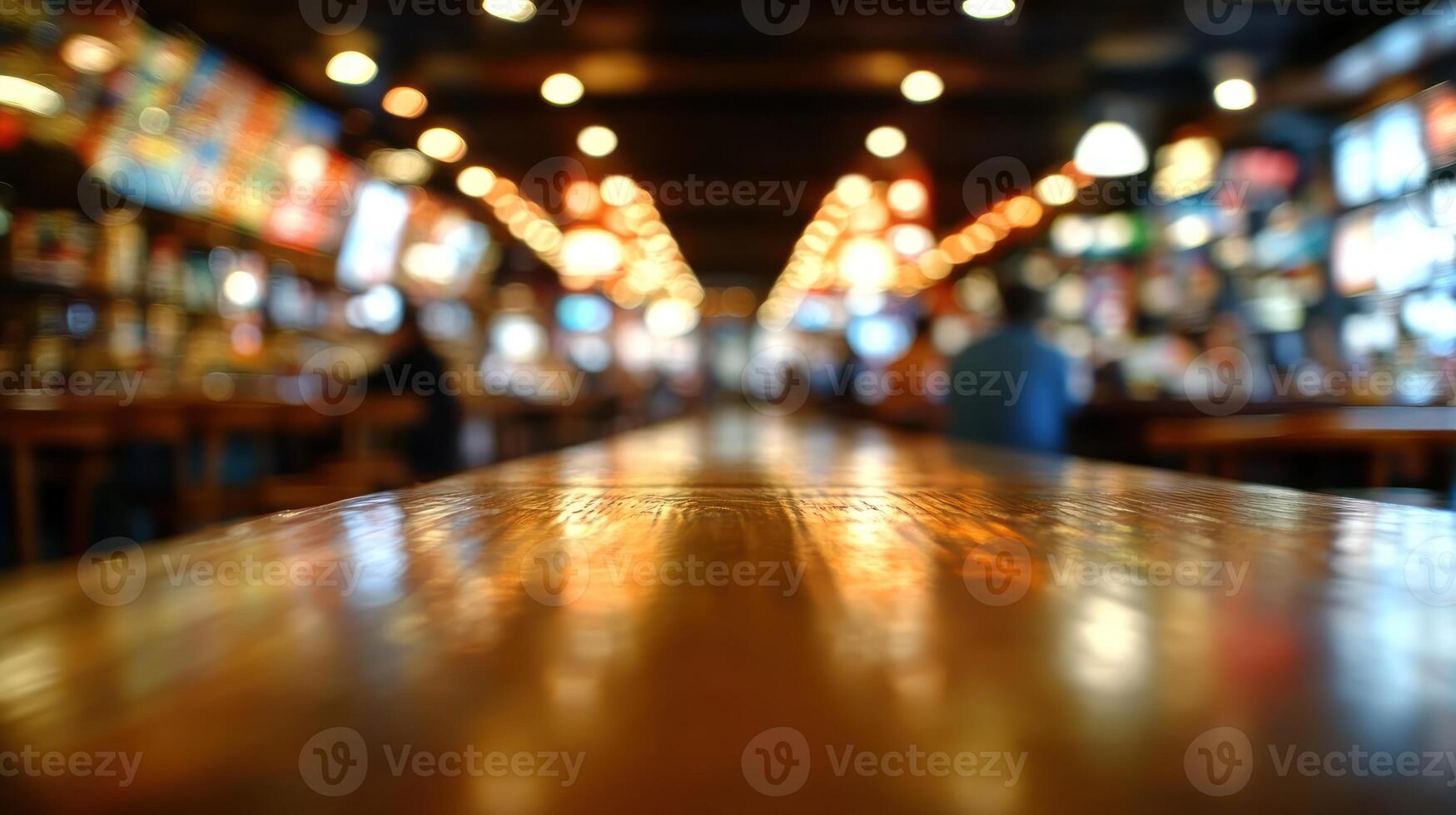 Patrons enjoy their time in a cozy bar adorned with warm lighting and inviting wood tones photo