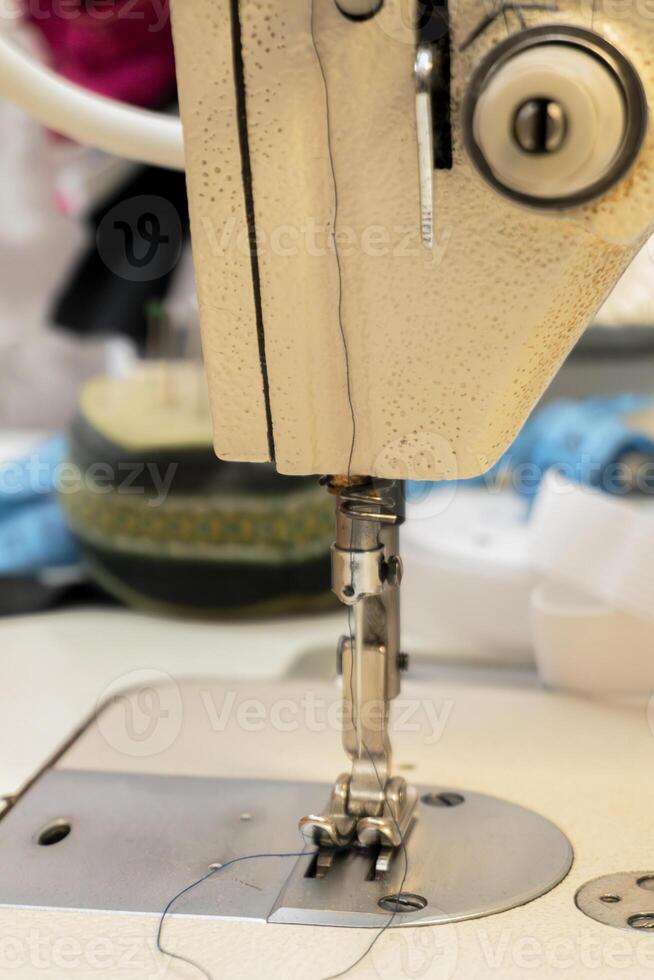 Close-up view of sewing machine in a crafting workspace photo