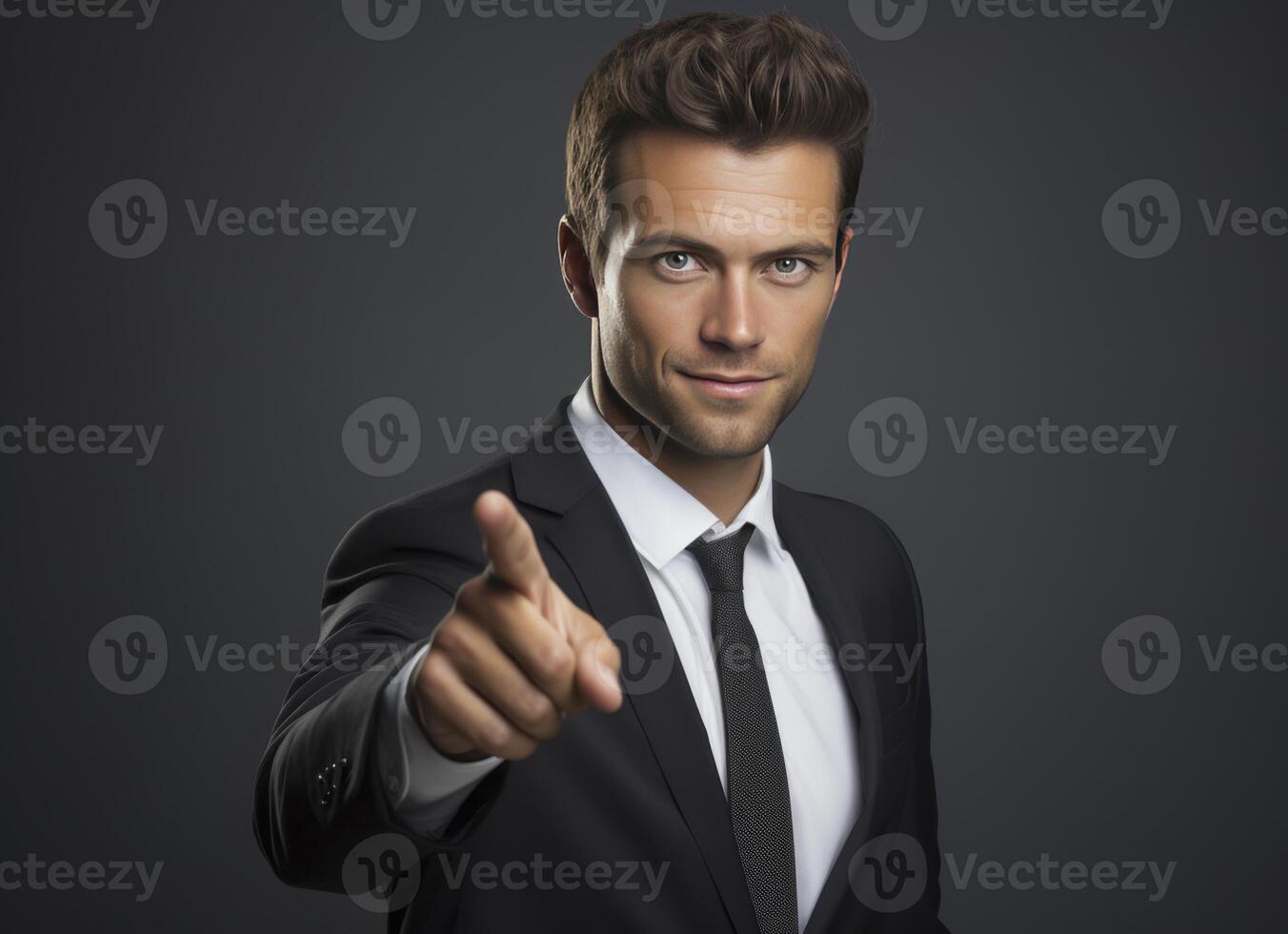 A well dressed man in a dark suit extends his index finger towards the viewer, conveying confidence and direct engagement photo