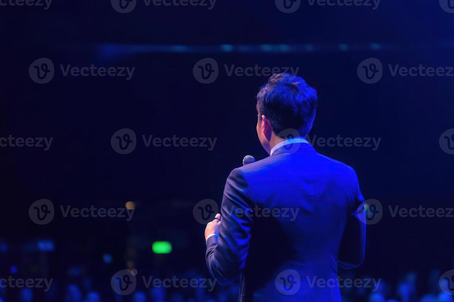 Speaker at Conference Businessman Presenting Audience Stage Microphone photo