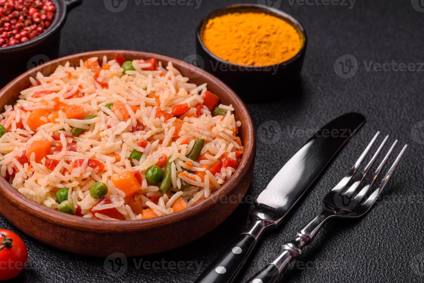 Boiled rice with vegetables, salt and spices photo