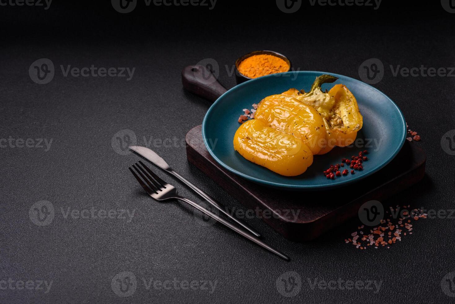 Yellow sweet pepper cut in half and grilled with salt, spices and herbs photo