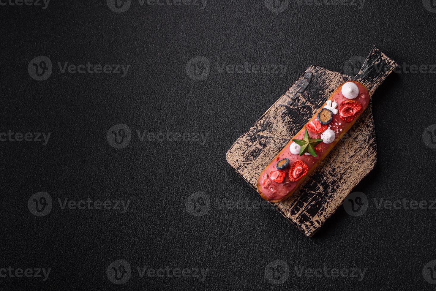 Sweet eclair with chocolate filling, decorated for Christmas photo