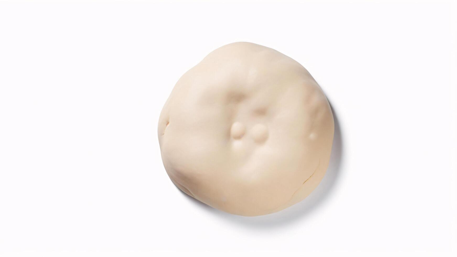 Close-up of a single beige, round, smooth object with a soft, natural texture. photo