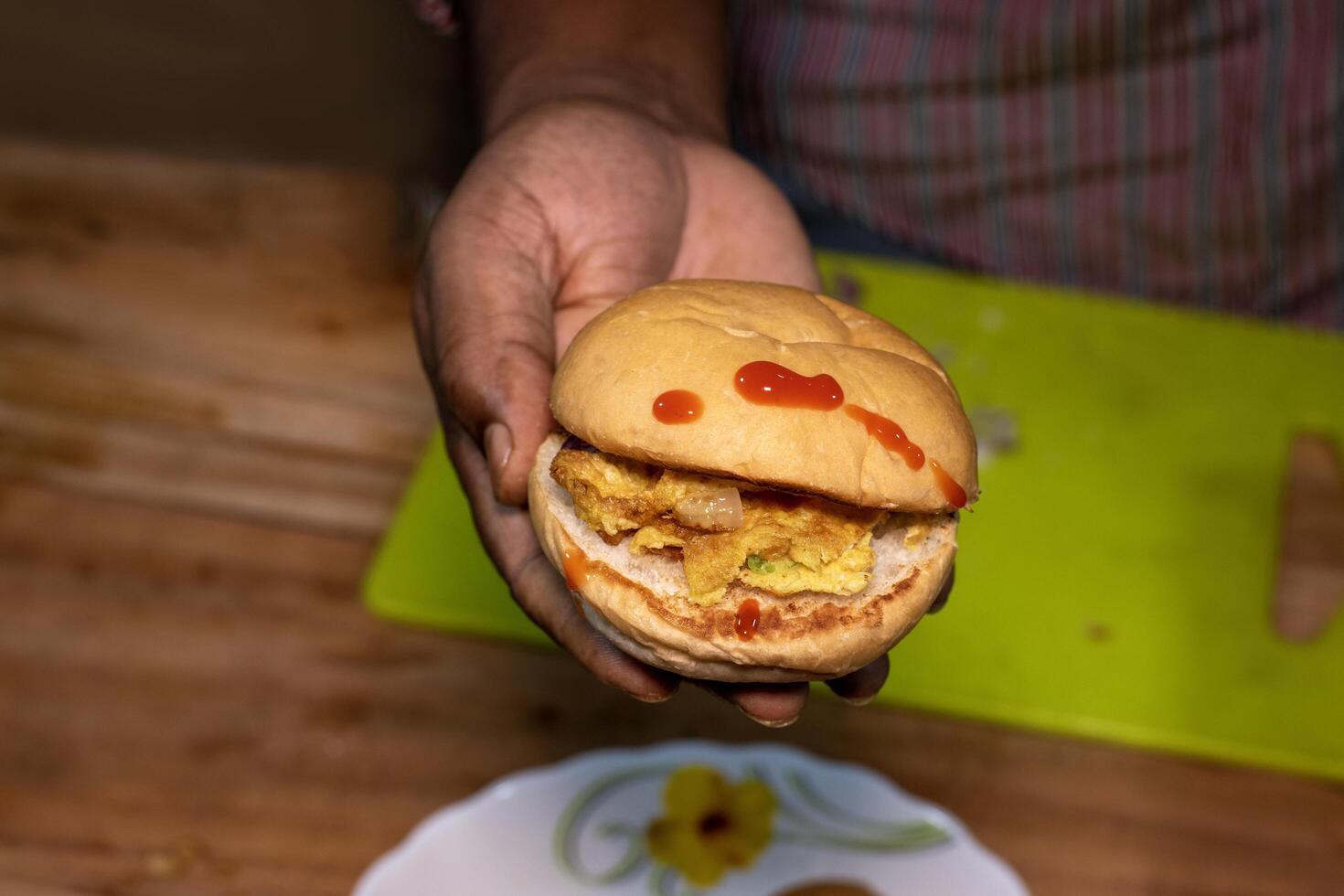 Mini Burger on hand with table background photo