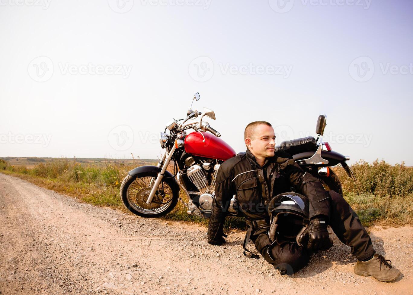 Biker on the country road photo