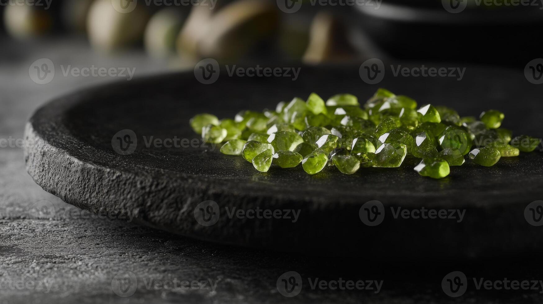 A collection of sparkling green gemstones rests on a textured stone surface, illuminated by soft light. The setting conveys a serene and earthy atmosphere, highlighting the gemstones natural beauty. photo