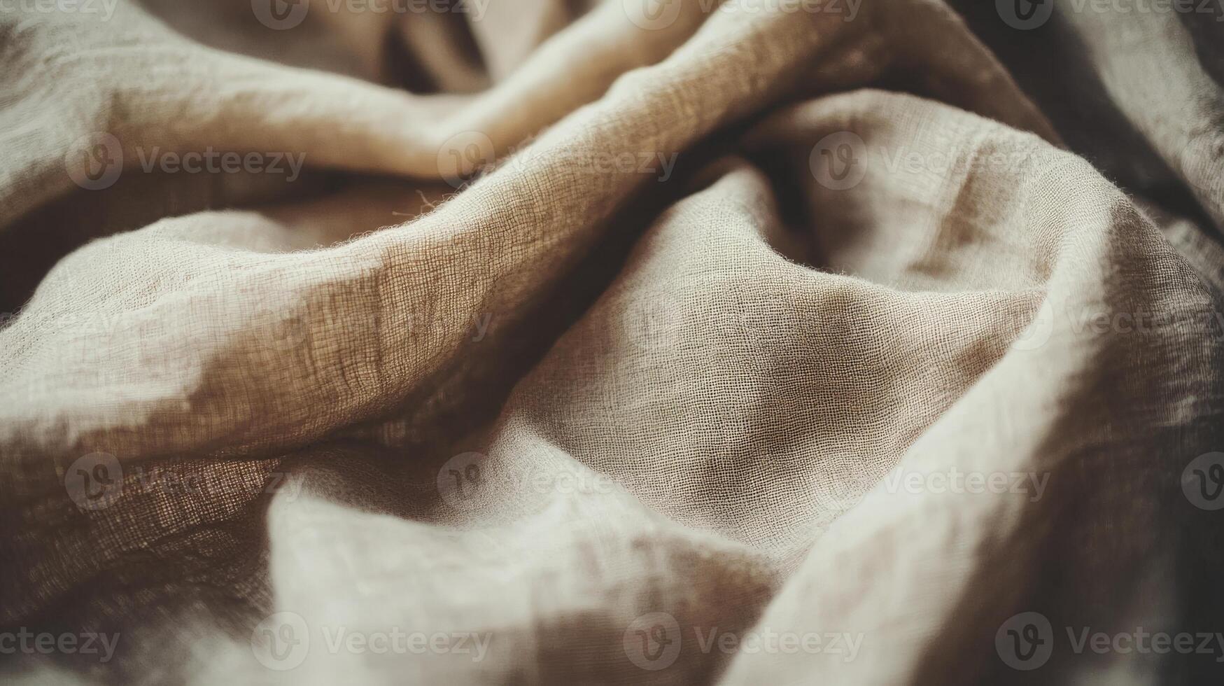 Soft texture of beige linen fabric with gentle folds and creases photo