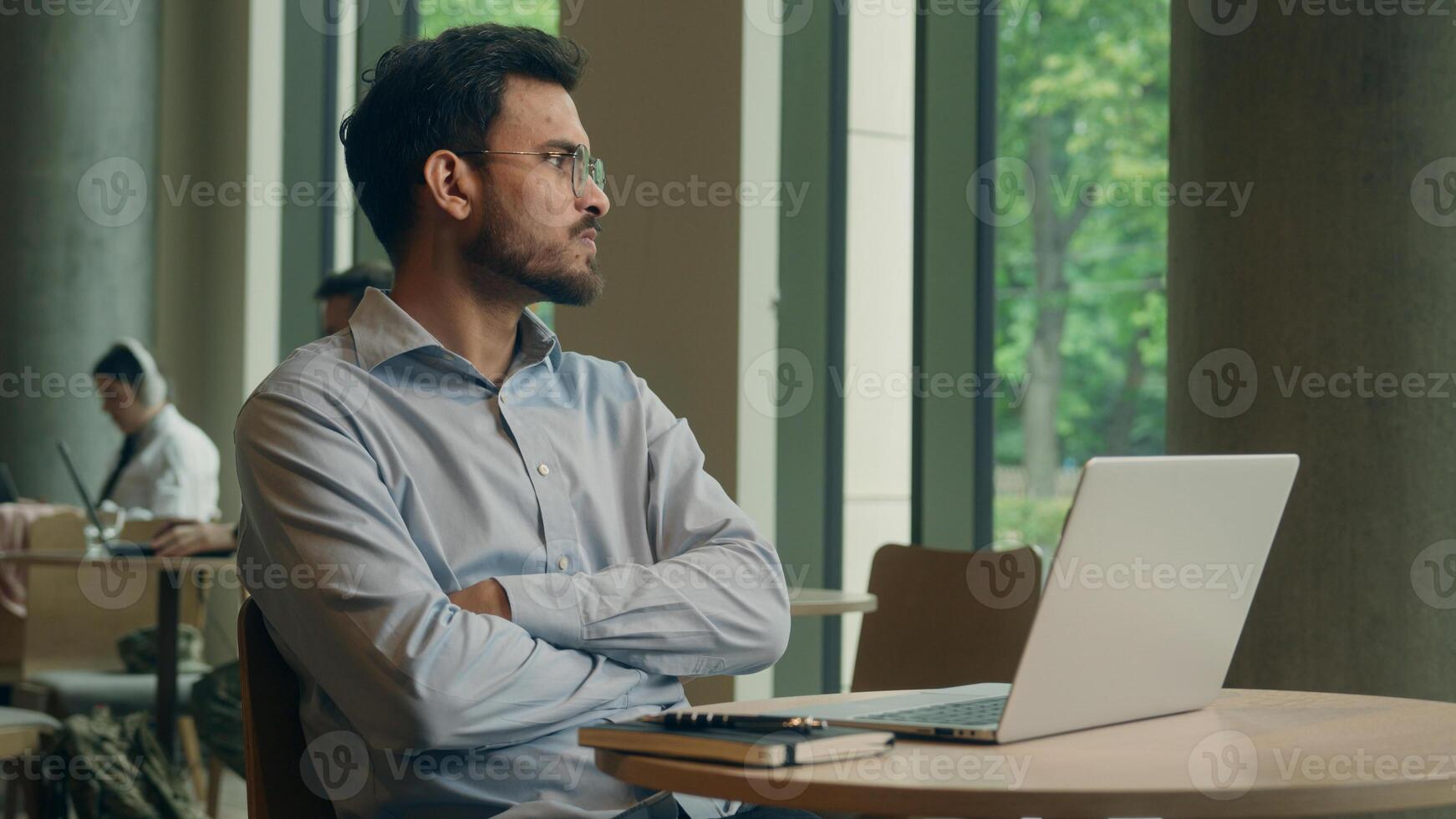 Angry man Arabian Indian male businessman freelancer employee business worker visitor cafe work online laptop computer displeased frustrated worried guy chatting read email deadline fail upset problem photo