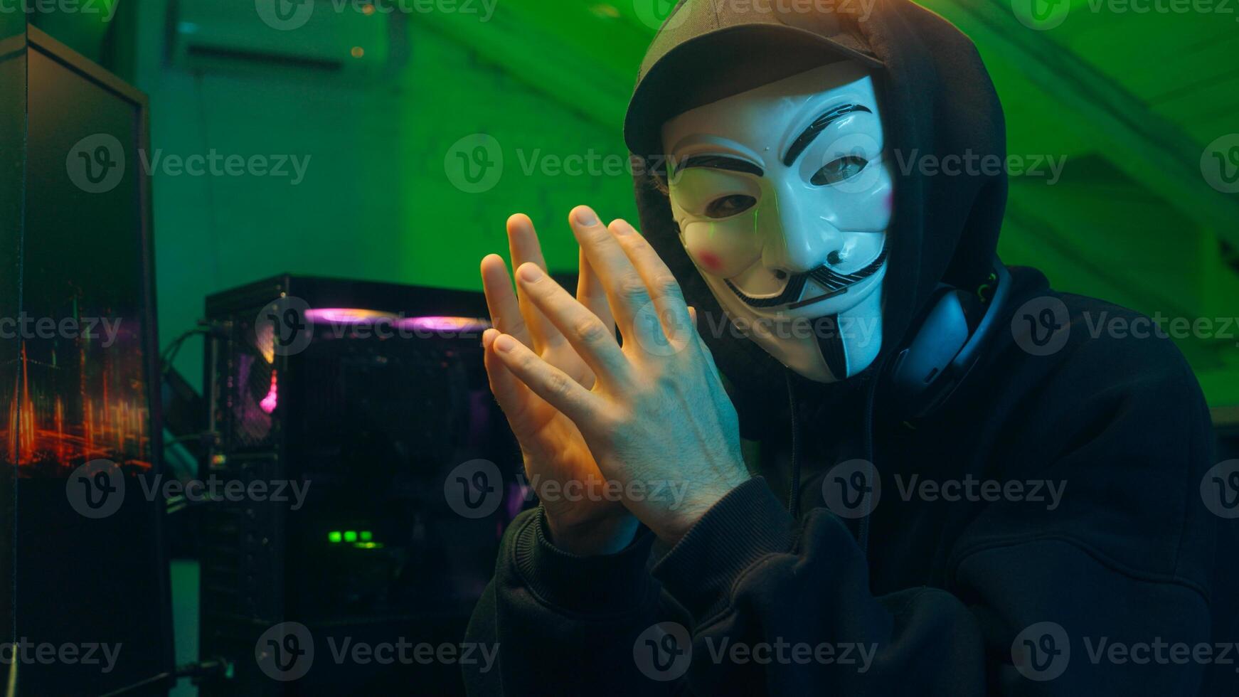 Lviv, Ukraine - June 03, 2024. Man programmer hacker computer pc coding spy steal internet cybersecurity anonymous cyber crime attack system phishing networking monitor scammer database web fingers photo