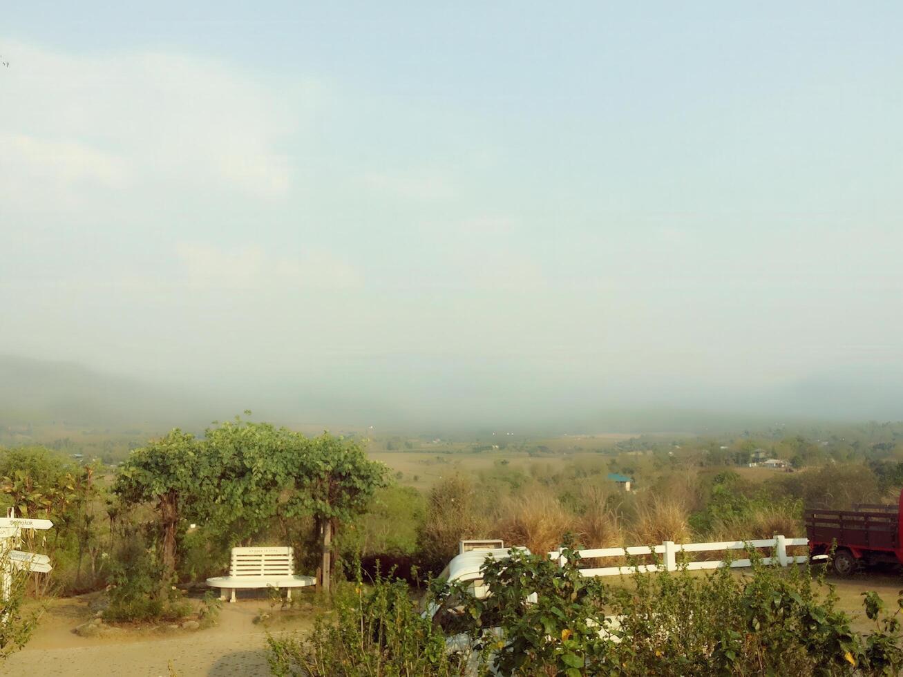 Scenic landscape view with lush greenery hills and open sky nature photography serene environment wide angle tranquility photo