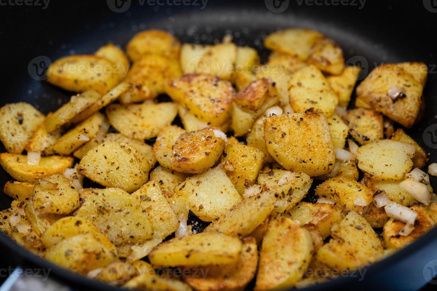 roasted potatoes in a frying pan photo