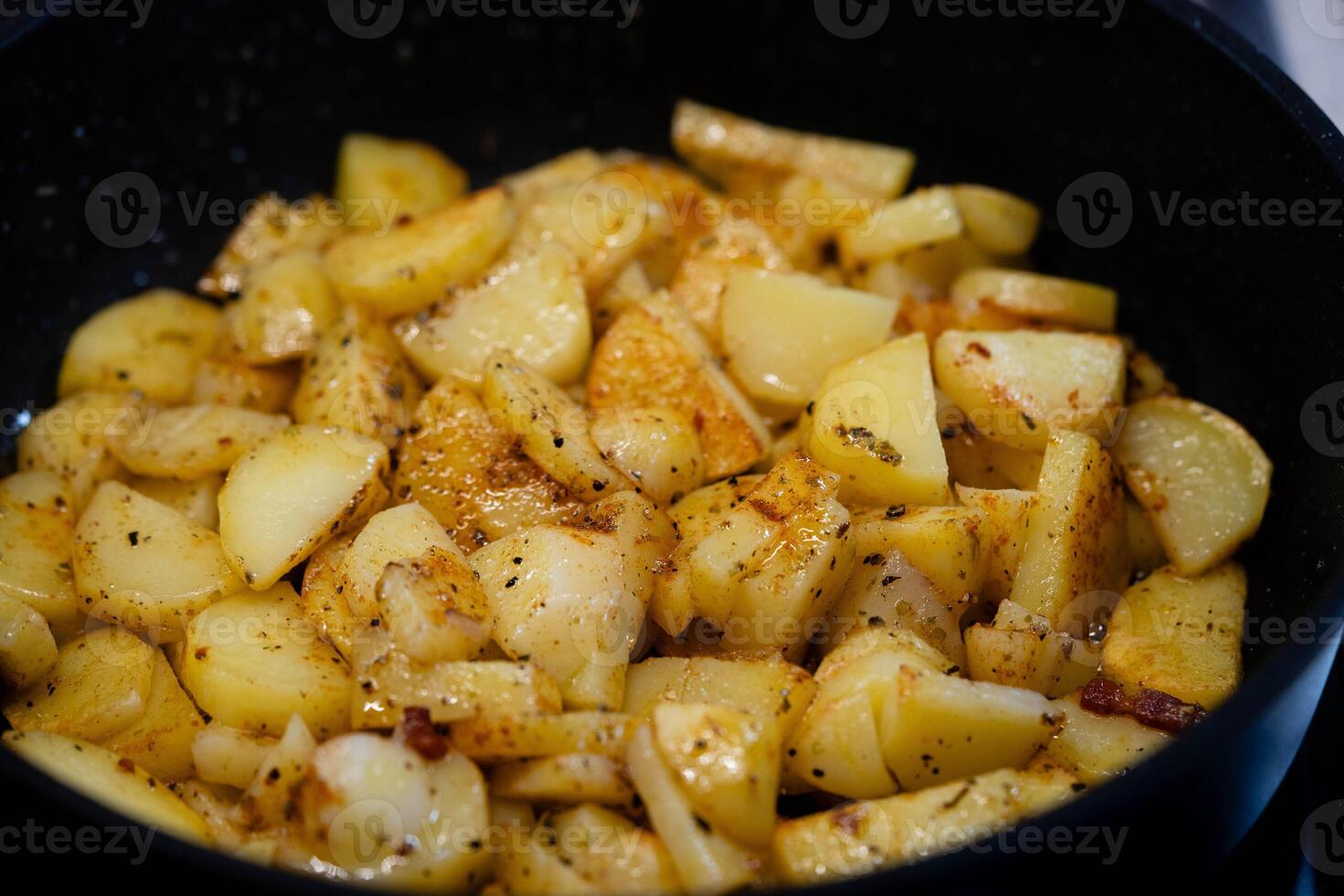 roasted potatoes in a frying pan photo