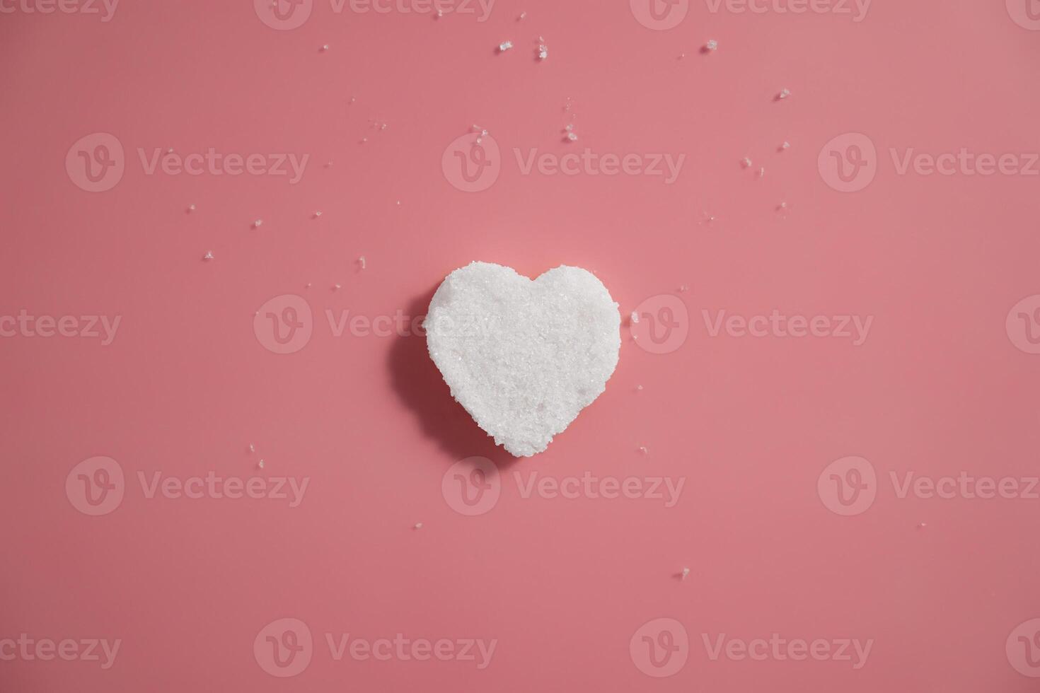 Heart Shaped body scrub on Pink Minimalist Background photo