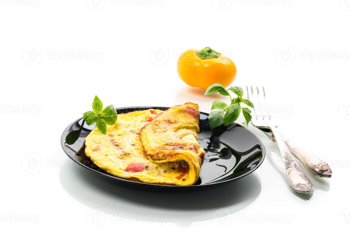 fried omelette with sweet pepper and vegetables in a plate, isolated on white background photo