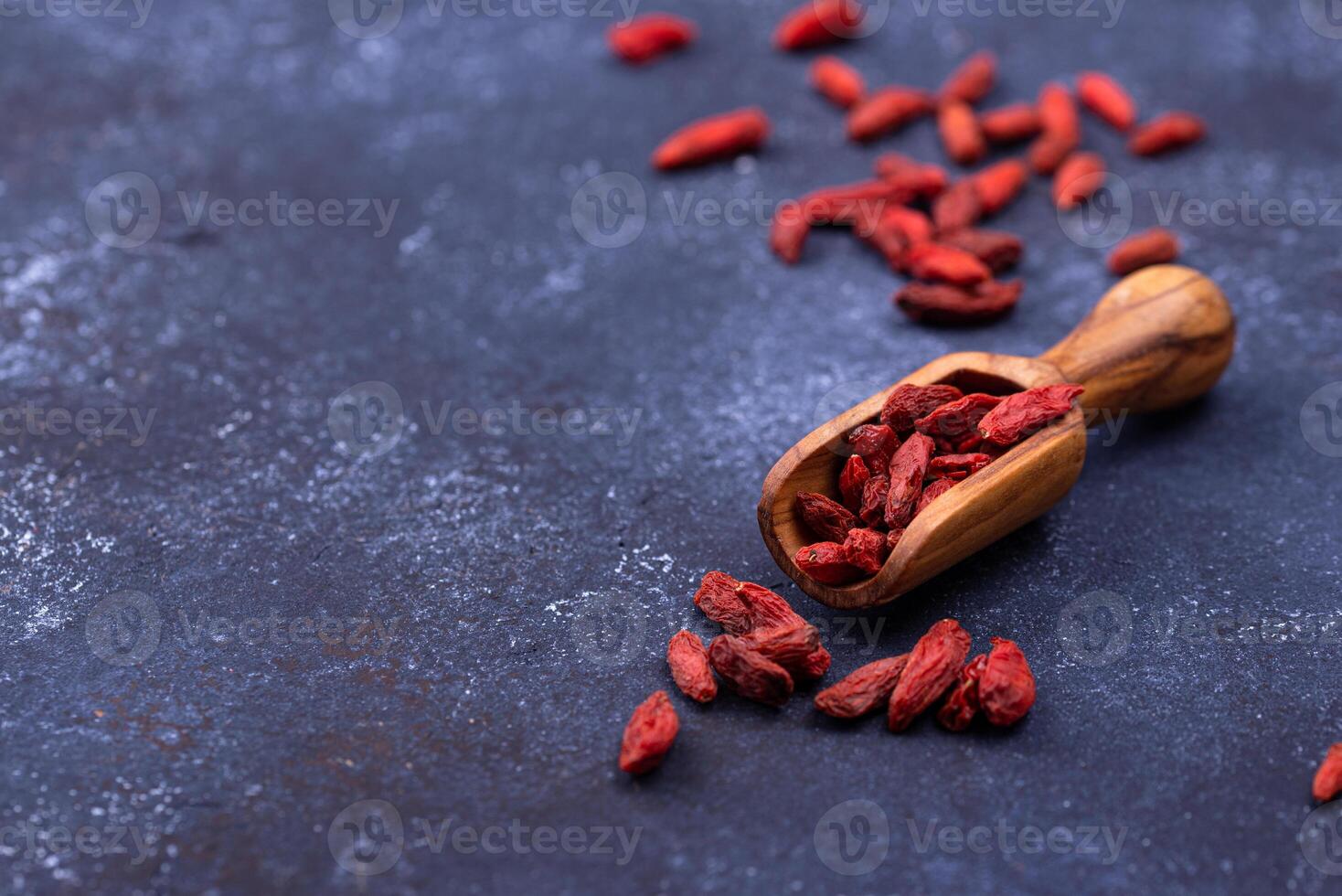 Goji berries on blue background photo