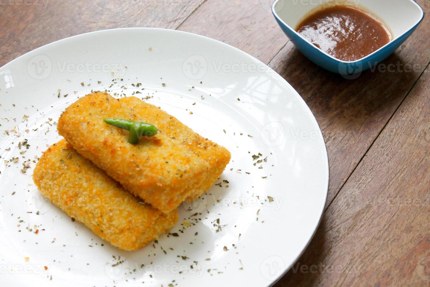 Golden Crispy Risoles with Red Chilis Sauce Close Up View Indonesian Snack Asian Cuisine photo