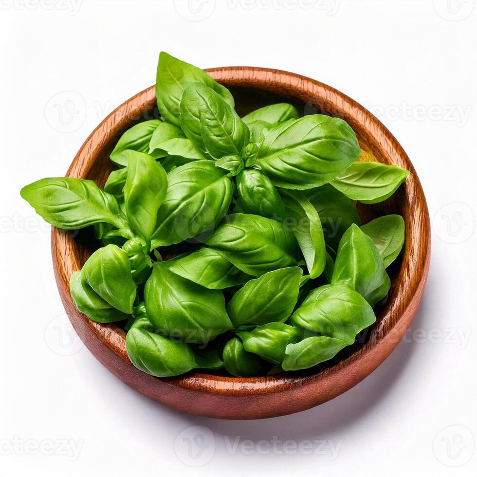 Basil in a wooden bowl, close up, front view, isolated in white background photo