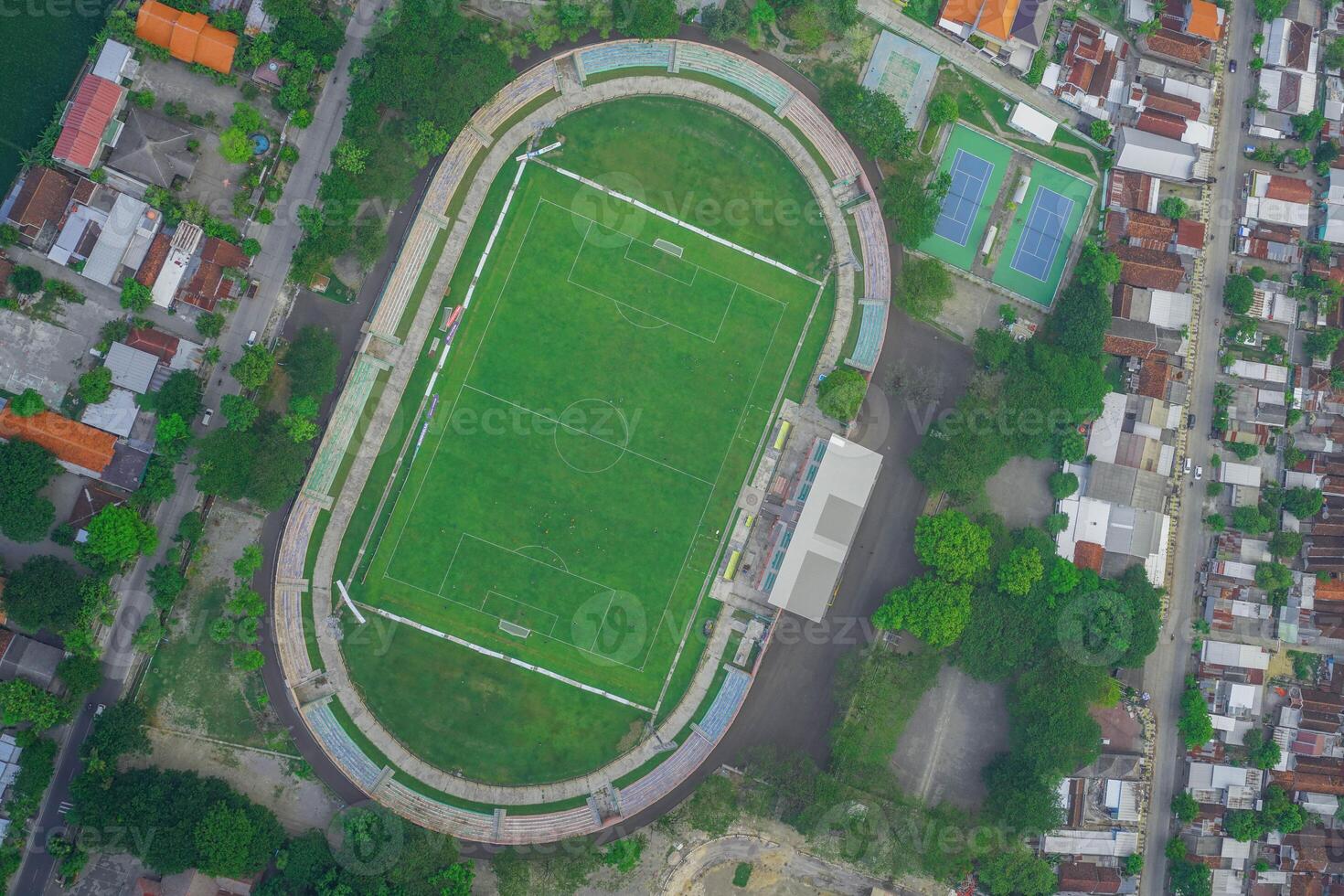 an aerial view of a soccer field in a city photo