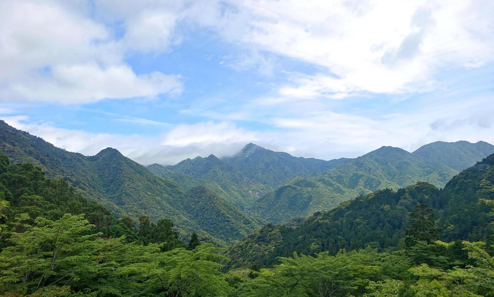 Outdoor countryside mountain hiking path with water fall in