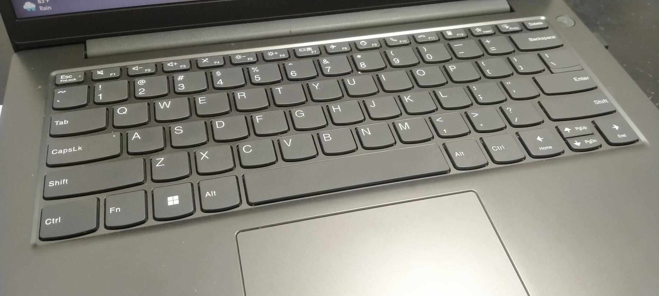Details of the laptop keyboard photographed from various angles, showing a modern design with an ergonomic key layout photo
