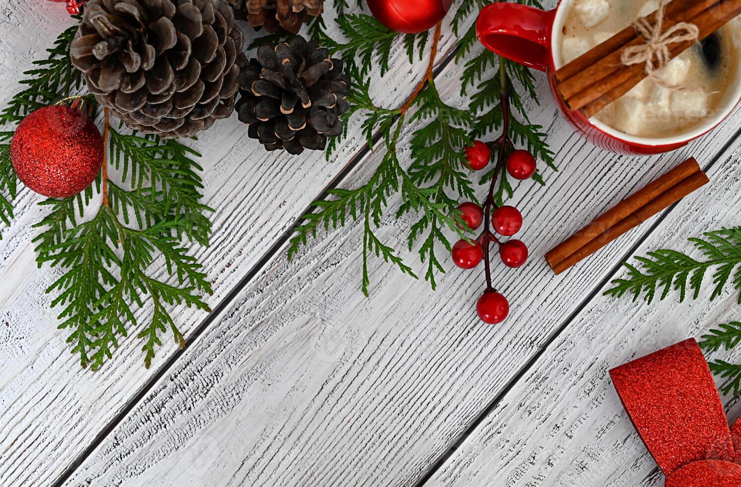 A joyful Christmas card embellished with playful toys, colorful fir branches, and a beautiful garland, accented with delicious treats and fragrant cinnamon. photo
