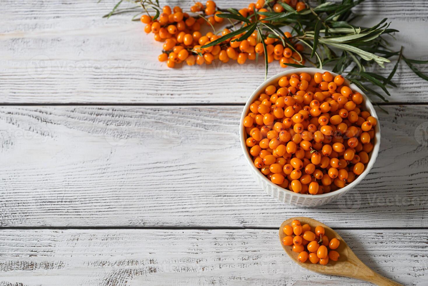 A nutritious combination for health and vitality.Sea buckthorn berries, honey, lemon, and cinnamon. photo