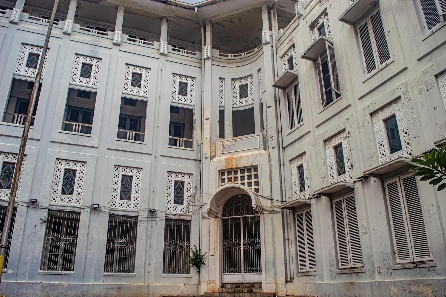 The Jiwa Sraya Building in Kota Lama Semarang showcases colonial architecture with intricate latticework and arched entrances, Indonesia, 16 November 2024 photo